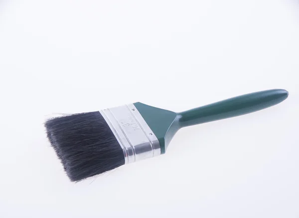 Paint brush or green paint brush on a background. — Stock Photo, Image