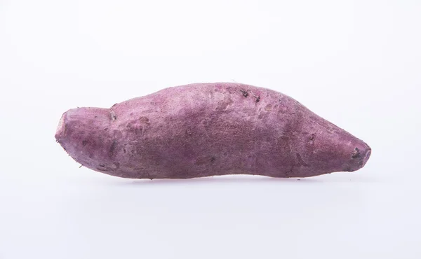 Sweet potato or fresh purple yams on background. — Stock Photo, Image