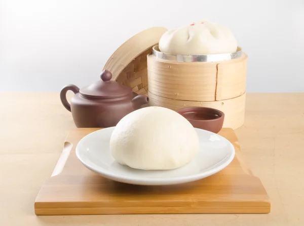 Pao or dim sum in bamboo steamer with chinese bun. — Stock Photo, Image