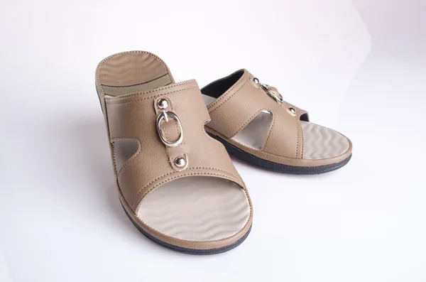 Zapato. sandalia de mujer de fondo. sandalia de mujer sobre un fondo . —  Fotos de Stock
