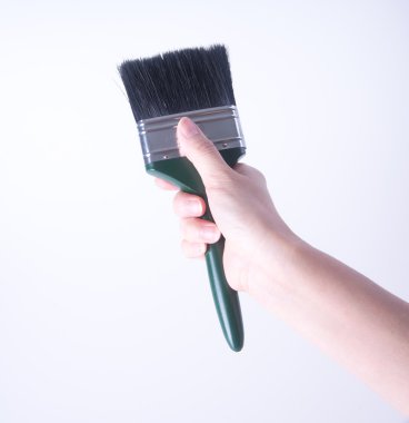 el ile boya fırçası. bir arka plan üzerinde el ile boya fırçası. 