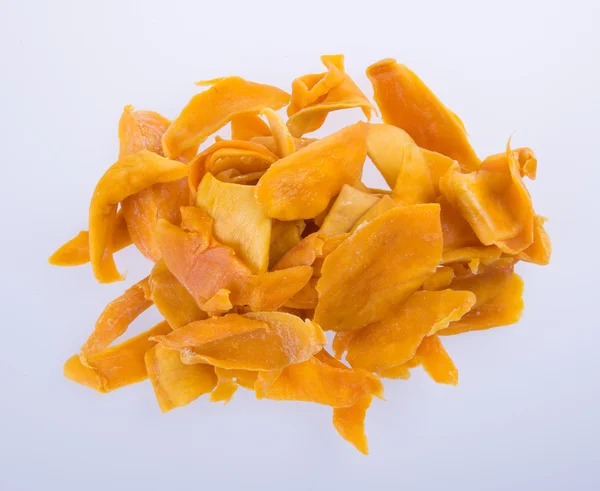 Mango mango suché nebo sušené plátky na pozadí. — Stock fotografie