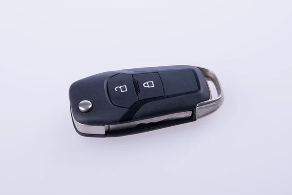 Κλειδί ή το κλειδί του αυτοκινήτου με απομακρυσμένο υπολογιστή στο παρασκήνιο. — Φωτογραφία Αρχείου