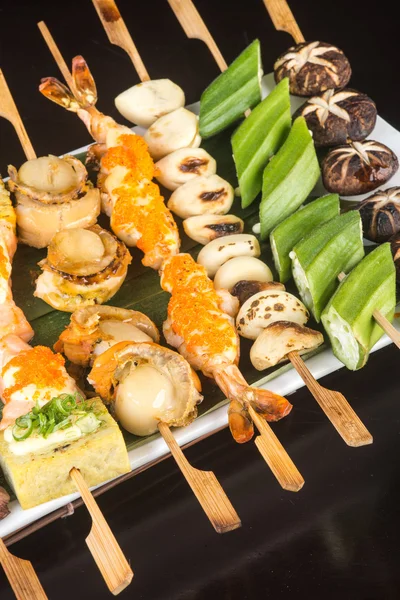 Japanese cuisine. grill stick on the background — Stock Photo, Image