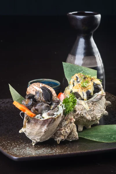 Japanese cuisine. grilled shell fish on the background — Stock Photo, Image