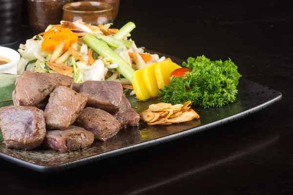 Japanese cuisine. beef cube on the background — Stock Photo, Image