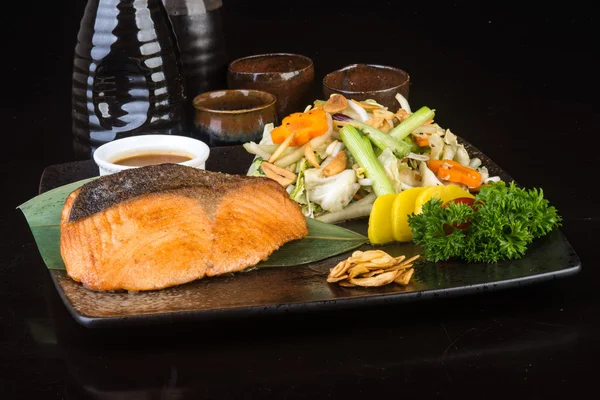 Japanese cuisine. fried fish on the background — Stock Image Japanese cuisine. fried fish on the background Stock Image