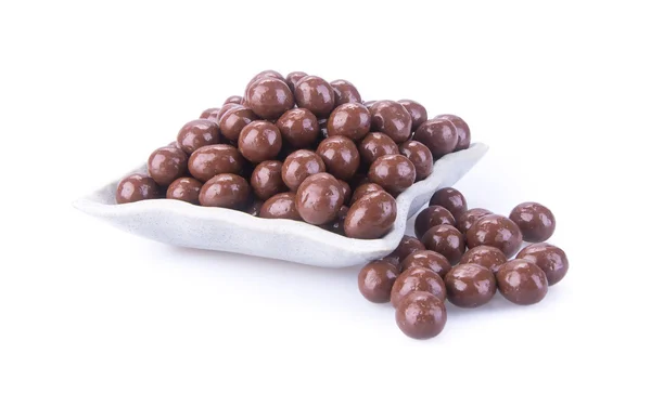 Čokoládové kuličky. čokoládové koule v misce na pozadí — Stock fotografie