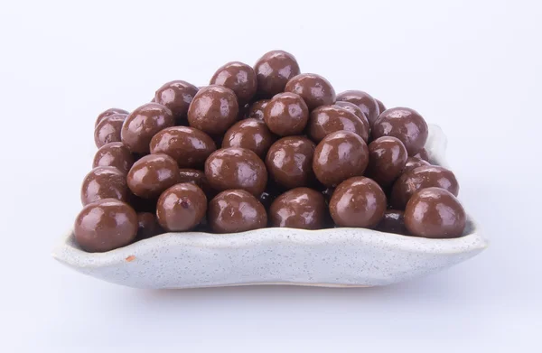 Bolas de chocolate. bolas de chocolate en un tazón sobre un fondo — Foto de Stock