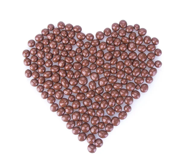 Chokladbollar. chokladbollar i kärlek form på en bakgrund — Stockfoto