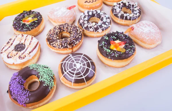 Donuts surtidos en un fondo — Foto de Stock