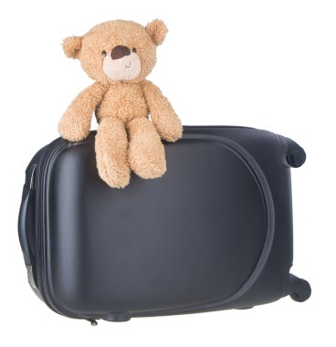 Bagaj ile ayıcık. Oyuncak ayı ve arka plan üzerinde