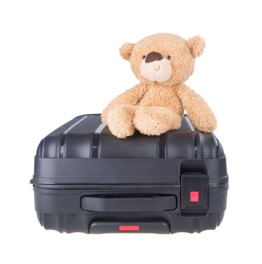 Bagaj ile ayıcık. Oyuncak ayı ve arka plan üzerinde