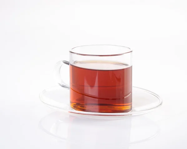 Thé dans une tasse en verre sur un fond. Thé dans une tasse en verre sur un backgrou — Photo
