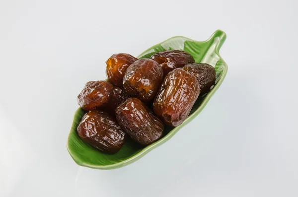 Dried preserved. Sweet syrup monkey apple or Chinese date on bac — Stock Photo, Image