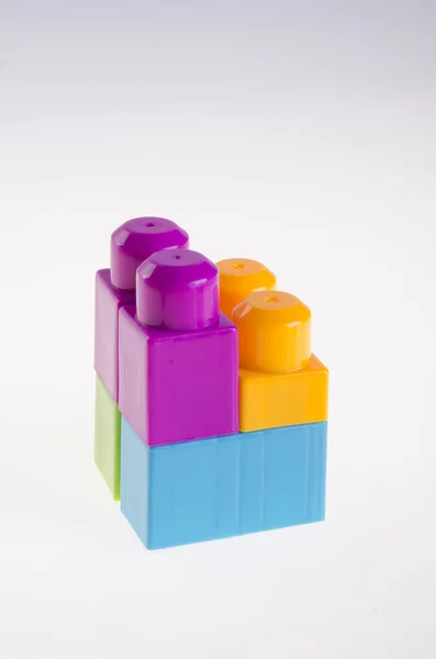 Plastic building blocks on background — Stock Photo, Image