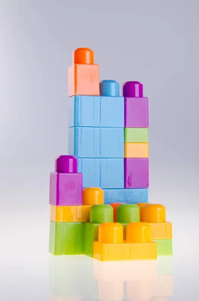 Plastic building blocks on background — Stock Photo, Image