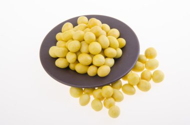 Peanutes veya arka plan üzerinde çıtır kaplamalı fıstık.