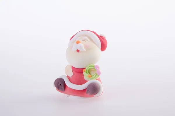 Santa claus figurku na pozadí — Stock fotografie