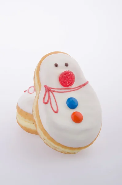 Donut, massa de boneco de neve no fundo — Fotografia de Stock