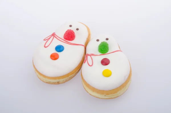 Donut, Schneemanngebäck auf dem Hintergrund — Stockfoto