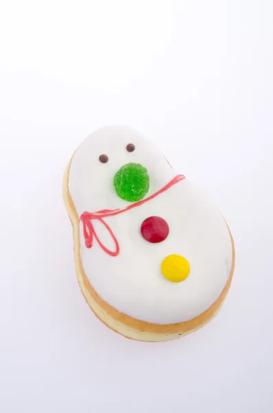 ドーナツ、背景に雪だるま菓子 — ストック写真