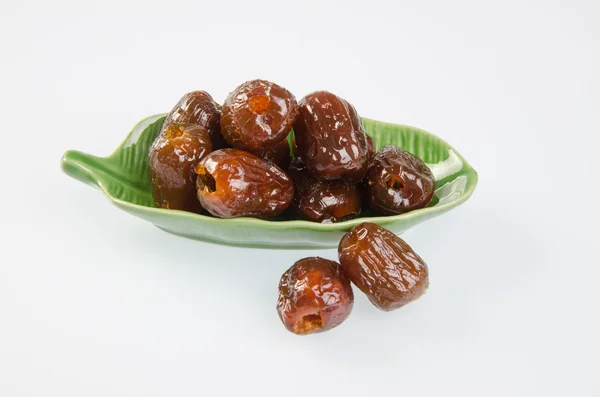 Dried preserved. Sweet syrup monkey apple or Chinese date on bac — Stock Photo, Image