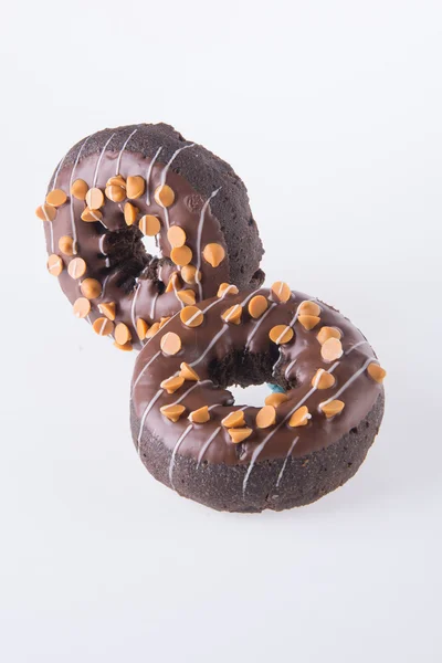 Donuts de chocolate em um fundo branco — Fotografia de Stock