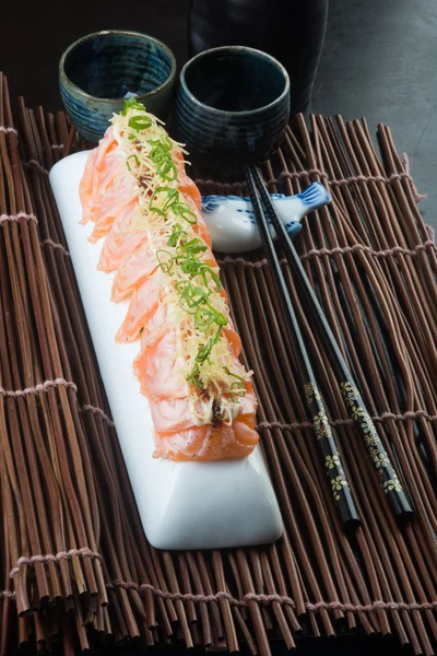 Japansk mat. sashimi på bakgrunden — Stockfoto