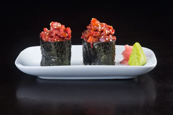 Cocina japonesa. pulpo de sushi en el fondo — Foto de Stock