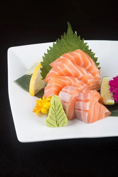 Japanse keuken. Sashimi op de achtergrond — Stockfoto