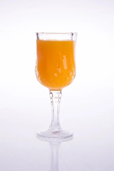 Orangensaft auf einem Hintergrund — Stockfoto