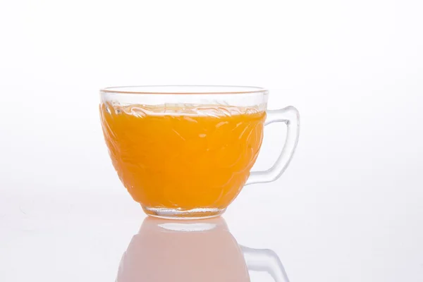 Orangensaft auf einem Hintergrund — Stockfoto