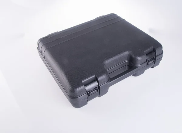 Black plastic tool box on the background — Stock Photo, Image