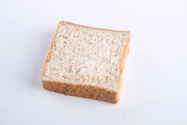 Fetta di pane su uno sfondo — Foto Stock