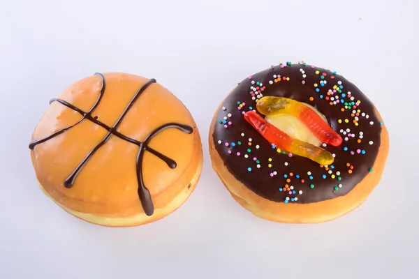 Donuts sortidos rosquinhas em um fundo — Fotografia de Stock