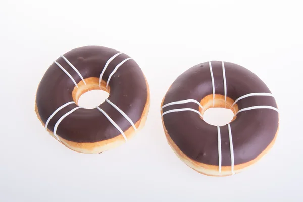 Donuts au chocolat sur fond blanc — Photo