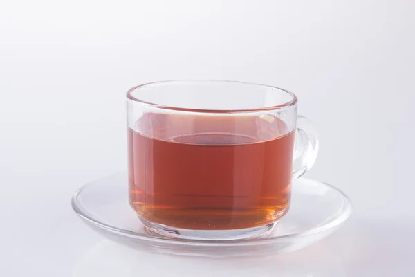 Té en taza de vidrio o taza de té negro sobre un fondo . —  Fotos de Stock