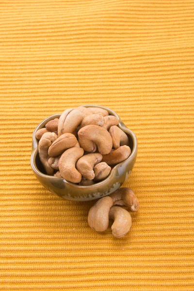 Nueces. nueces de anacardo en el fondo — Foto de Stock