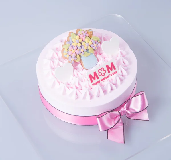 Kaka eller mödrar dag tårta på en bakgrund. — Stockfoto