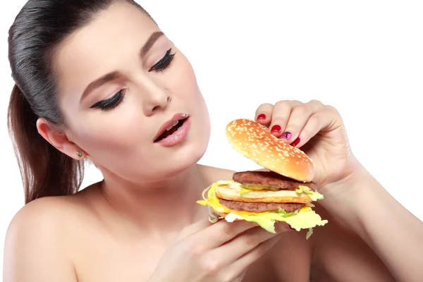 Grappig meisje eet groenten op witte achtergrond — Stockfoto