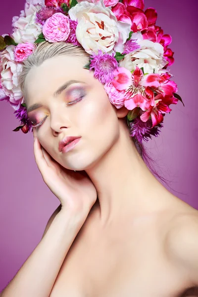 Beautiful  girl with varicoloured flowers — Stock Photo, Image