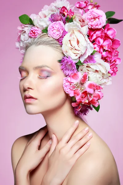 Beautiful  girl with varicoloured flowers — Stock Photo, Image