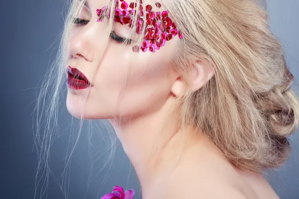 Beautiful  girl with varicoloured flowers — Stock Photo, Image