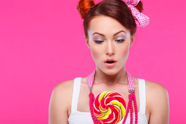 Redheaded girl with candy — Stock Photo, Image