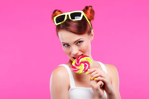 Redheaded girl with candy — Stock Photo, Image