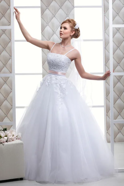 A photo of sexual beautiful bride in a wedding-dress is in fashion style. Wedding decorations — Stock Photo, Image