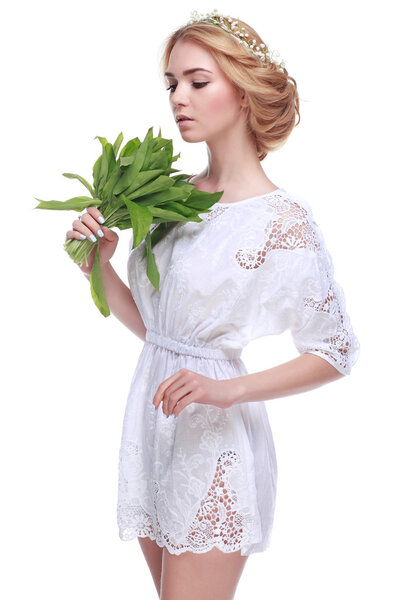 Beautiful sexual blonde  in white clothes with the basket of flowers isolated on a white background