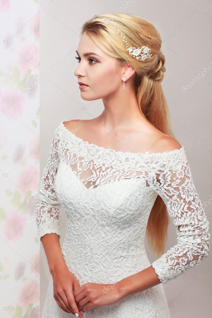 A photo of sexual beautiful girl in a wedding-dress is in fashion style. Wedding decorations