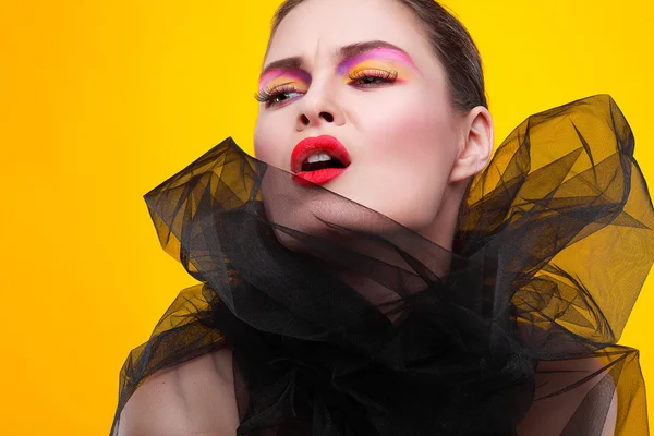 Portrait of sexual young girl in a black veil on a yellow background — Stock Photo, Image